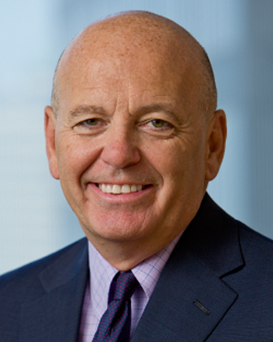 Paul J Reilly, Assurant Board Member, dressed in a suit and tie and looking at the camera